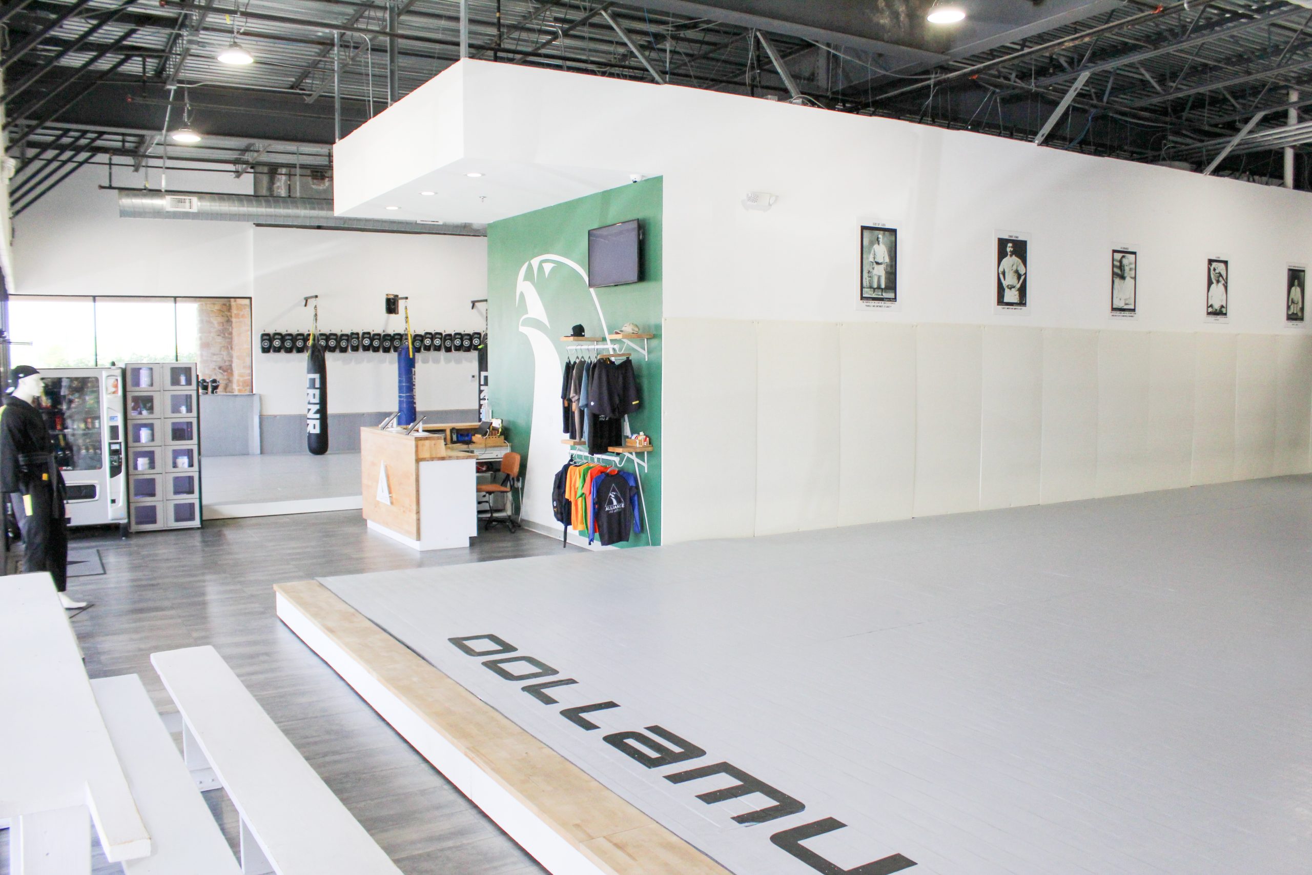 Wide view of the pro shop, mural wall, and main mat at our Pearland academy