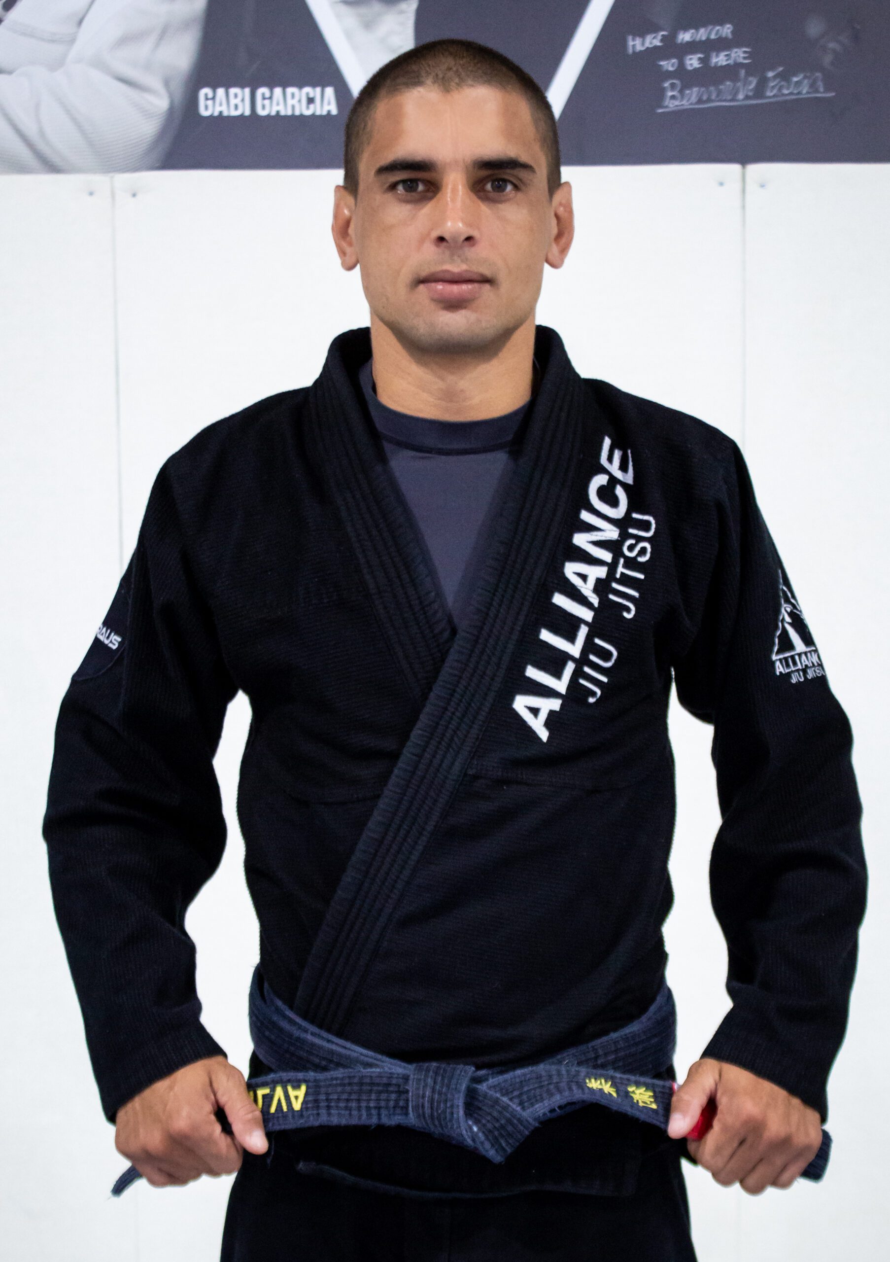 Coach Alef in a black Alliance Jiu Jitsu kimono at our Houston academy