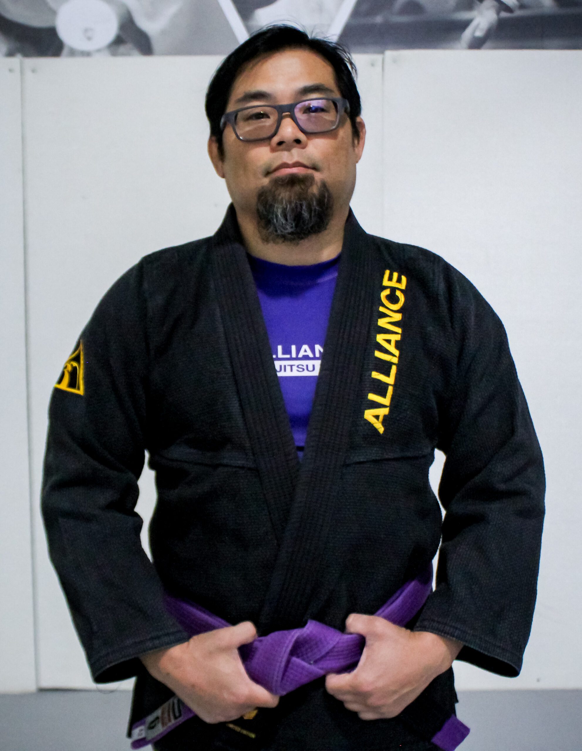 Coach Mike in a black Alliance gi running our Muay Thai and boxing programs