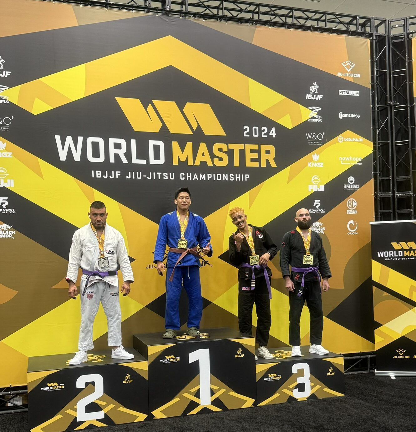 Alliance Jiu-Jitsu competitor on the top step of the IBJJF World Master 2024 podium