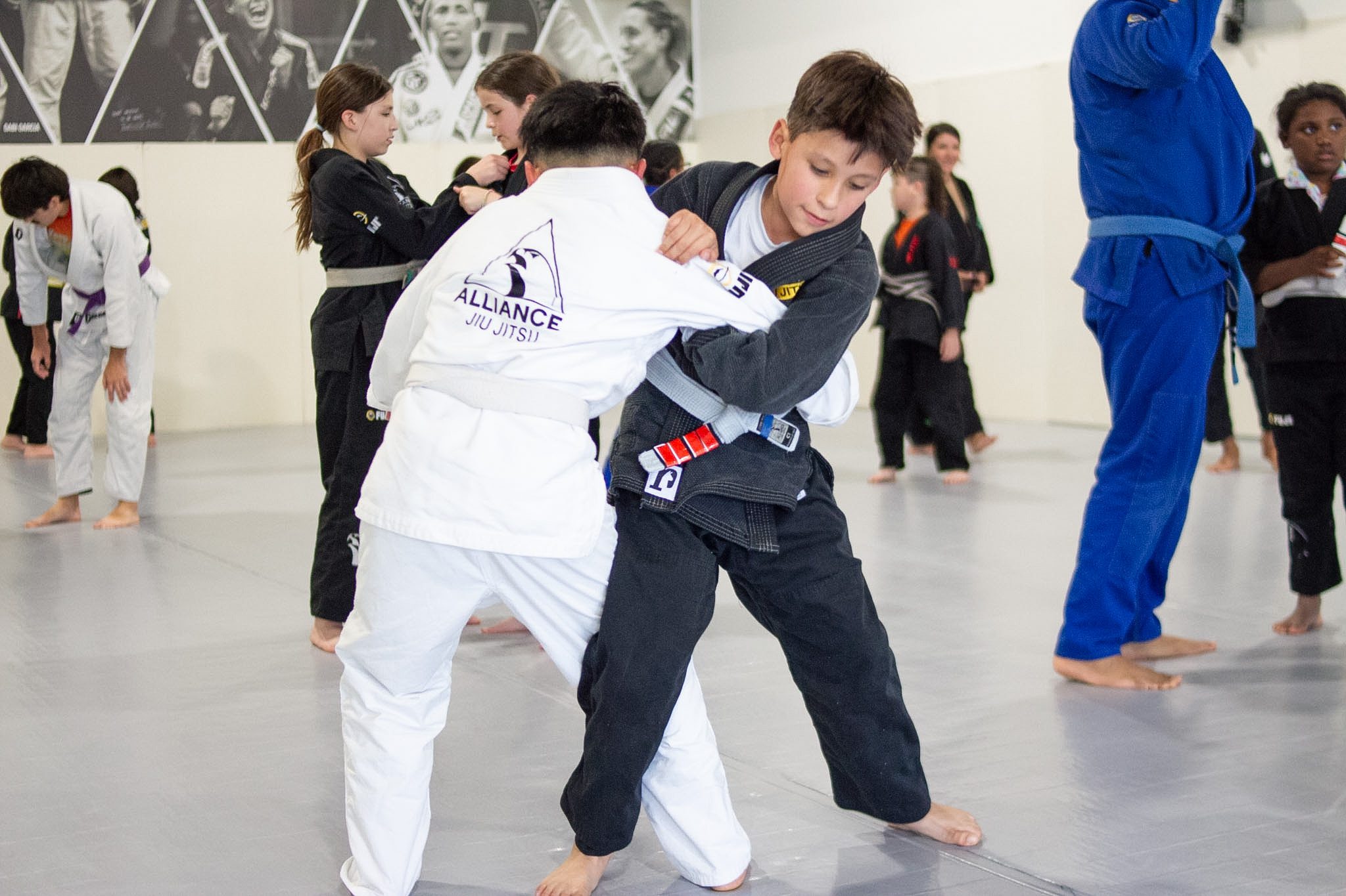 Two boys grip fighting during kids Brazilian jiu-jitsu class