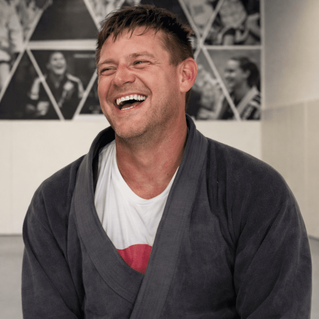 Wade Howard laughing in a gi during his Alliance BJJ Houston testimonial
