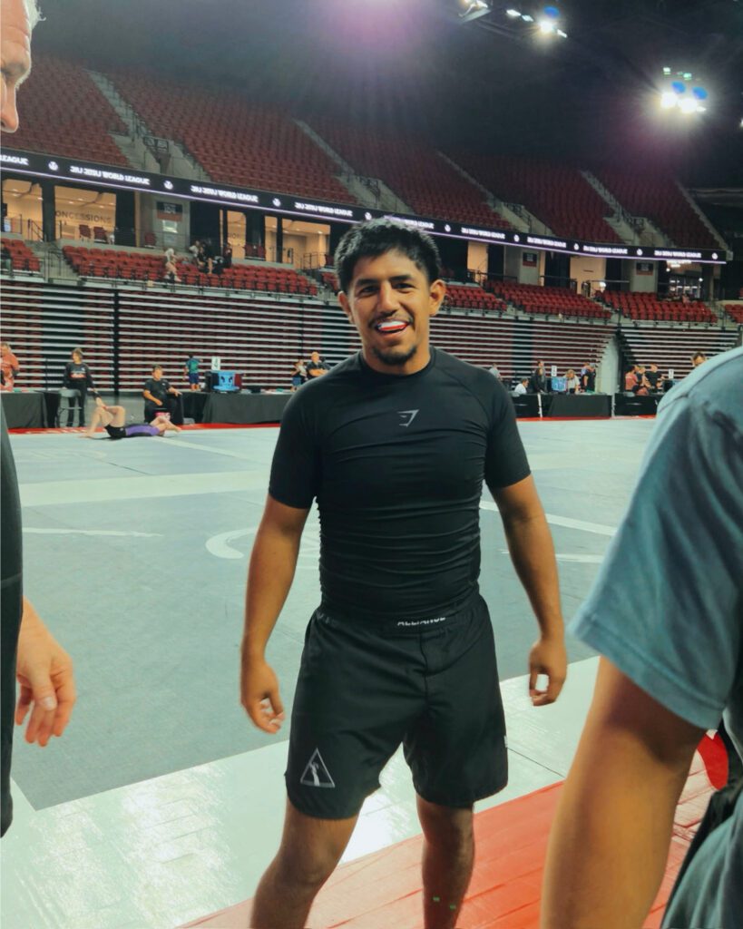 Ruben Lara in rashguard and shorts before his No-Gi match, mouthguard in