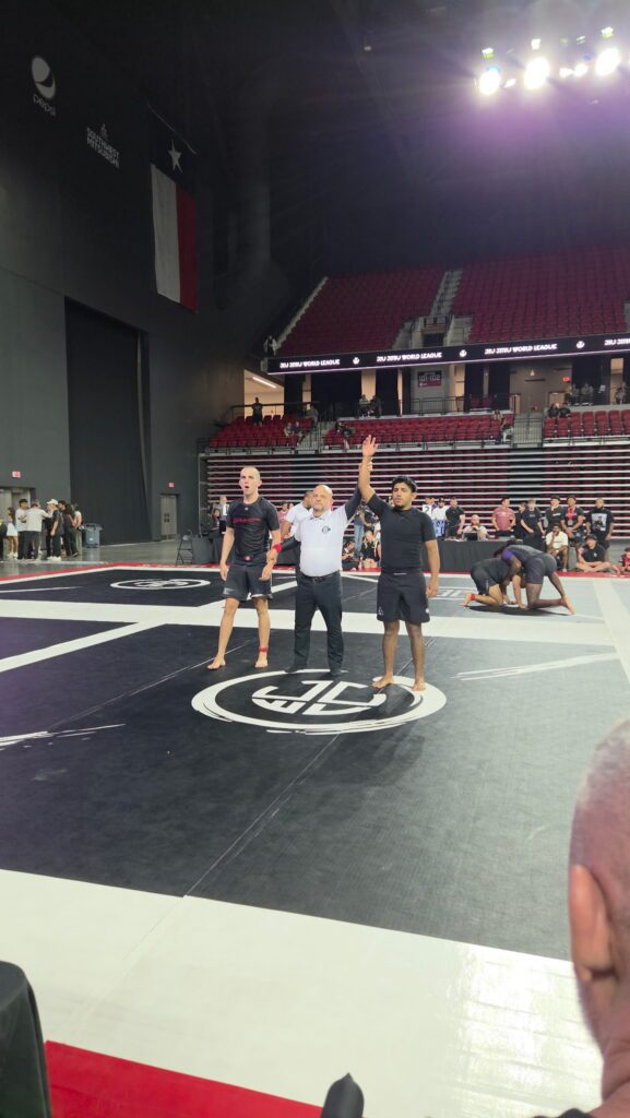 Ruben Lara has his hand raised after winning a No-Gi match in Rosenberg
