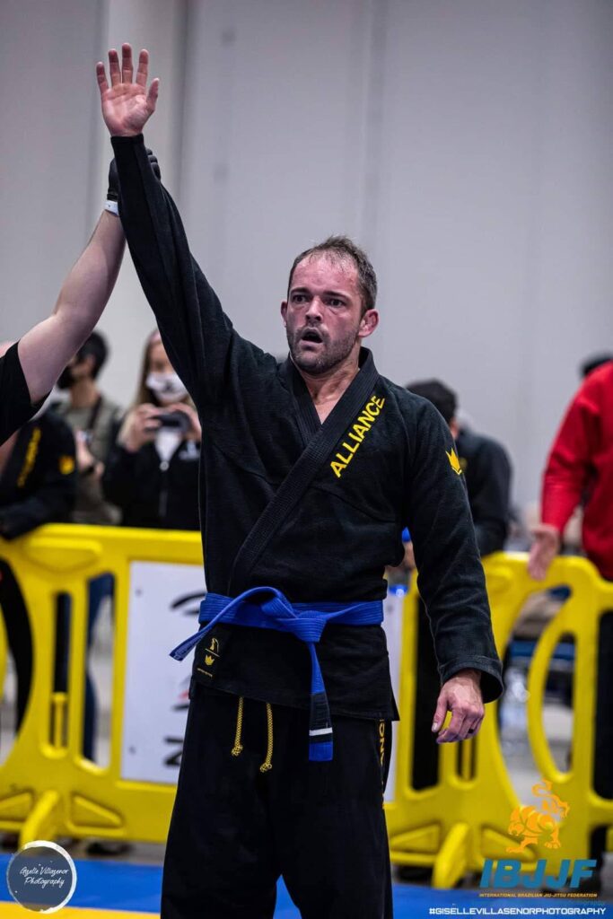 Referee raises Jeremy Woodin’s hand after a win at an IBJJF tournament