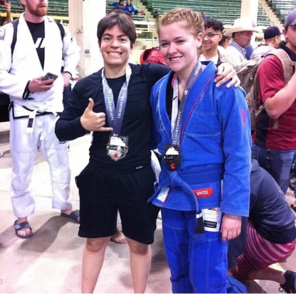 Kailee Crossey in a blue gi beside a fellow Colorado State Championships medalist